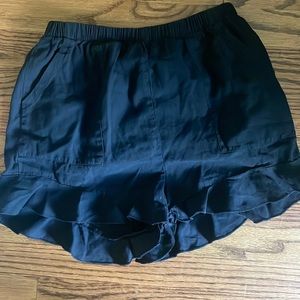 black shorts with ruffle at the end